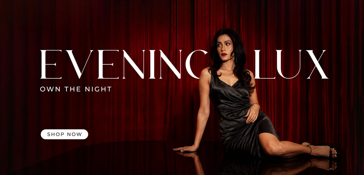 Woman in a gray evening gown against a red curtain with 'Evening Lux' branding.
